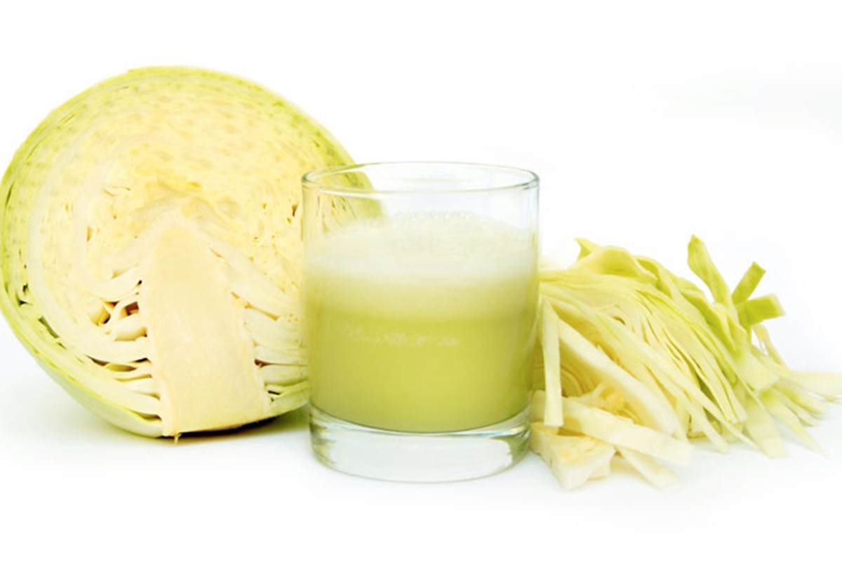 Fresh juice of cabbage on white