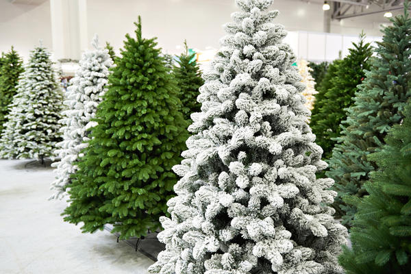 Decorative artificial christmas trees in the store